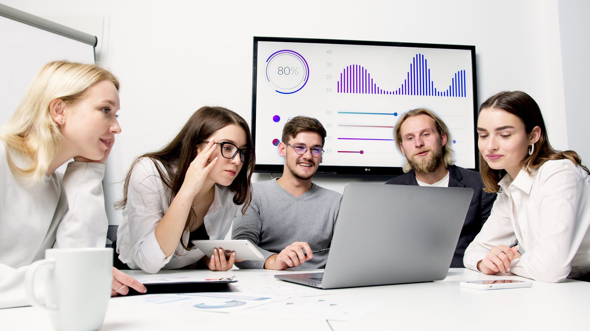 MetaBuzz Tech team collaborating around a project dashboard